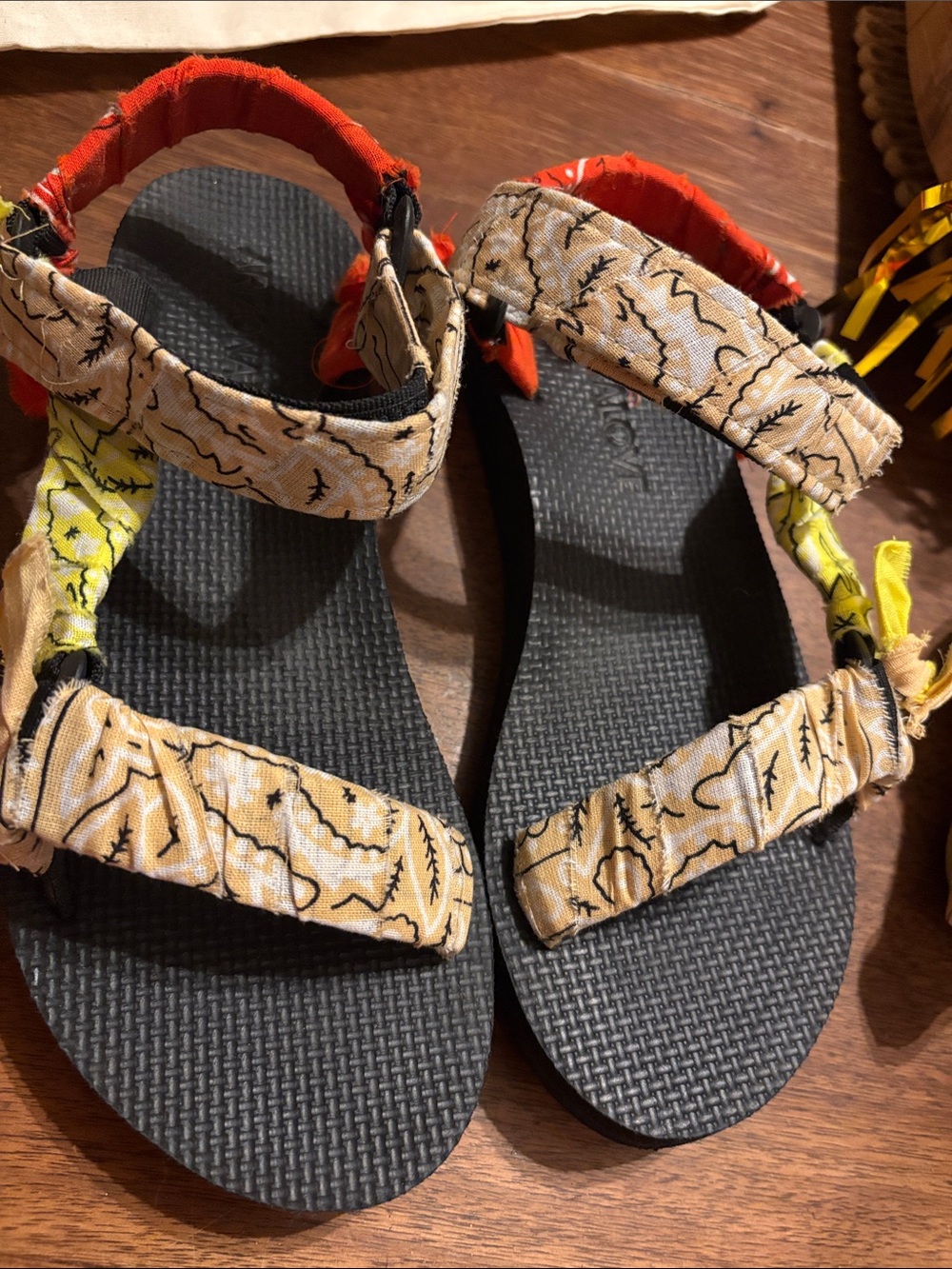 Arizona Love Black Footbed Sandals with Beige Printed Straps and Red Accents